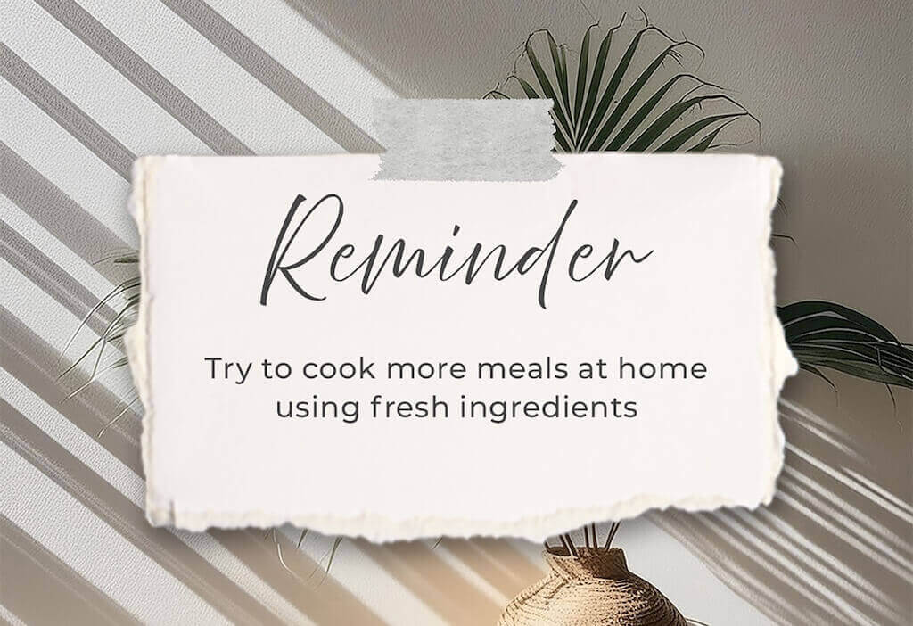 Inspirational quote card with a reminder to cook at home using fresh ingredients, styled with soft lighting and natural decor elements