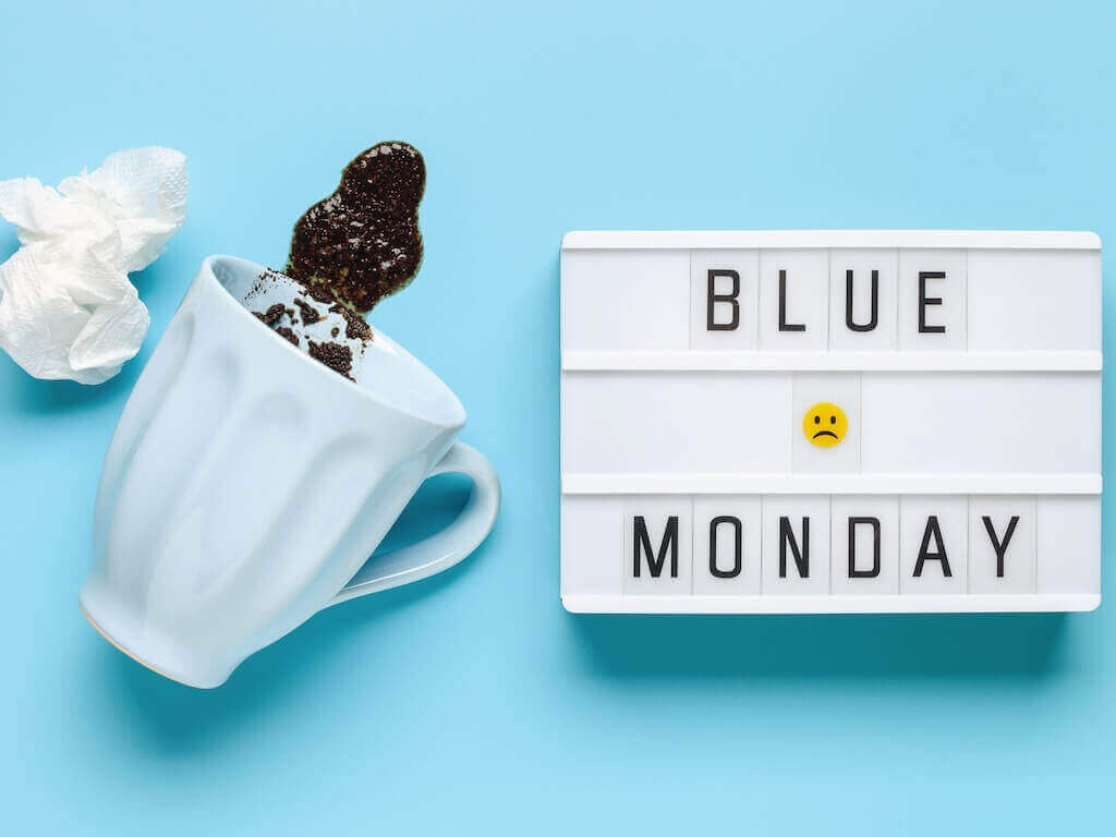 Why Mondays are less effective for webinars Spilled coffee and Blue Monday sign symbolizing low engagement at the start of the week