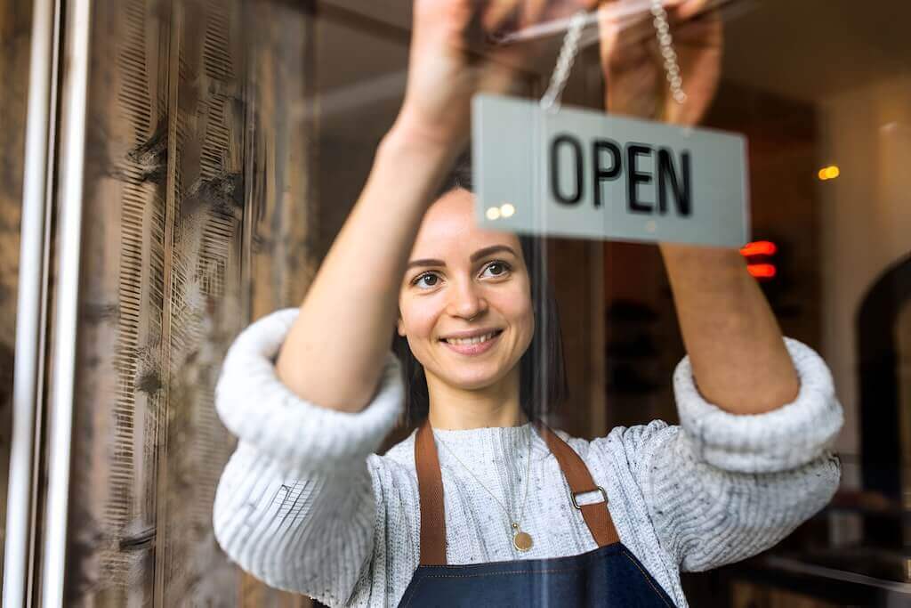 A business owner conducting a webinar to share growth strategies with clients